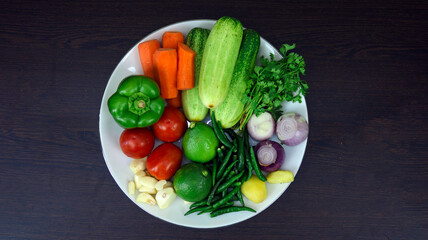 Assortment of Fresh Cooking Ingredients Including Egg, Onion, Green Chili, Coriander Leaves, Cucumber, Tomato, Cabbage, Potato, Bread, Noodles, Sugar, Jackfruit, Carrot, Garlic, Ginger, Lemon