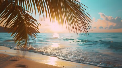 Fototapeta premium Summer background image of tropical beach with blurred horizon at sunset. Light sand of beach against backdrop of sparkling ocean water. Natural seascape. 
