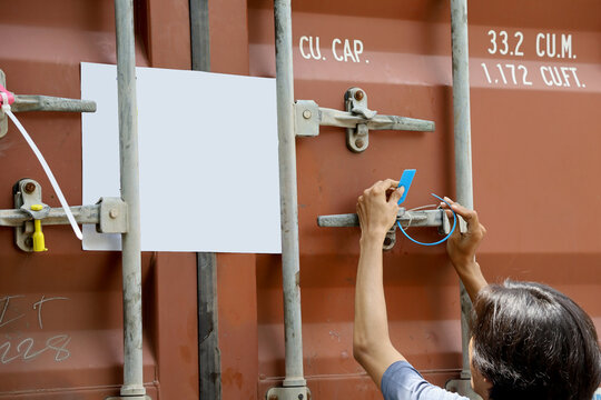 officers seal the container doors after the loading process is complete. Container security seal with code number to maintain goods security during shipping.