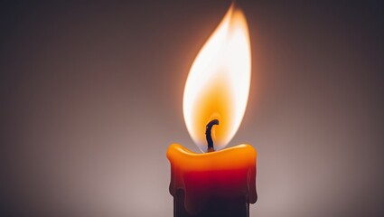 Close-up of a lit candle, emphasizing warmth and tranquility.