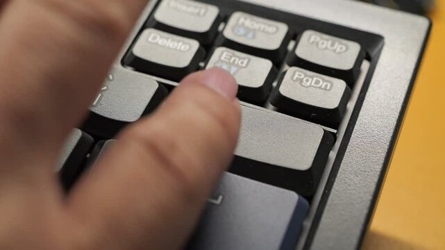 Black Laptop Spacebar Hit. Person types and hits the spacebar on a laptop.