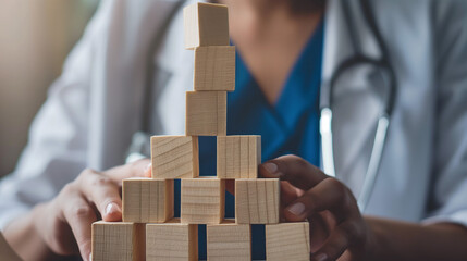 Doctor building pyramid with wooden blocks, medical concept, professional development, copy space