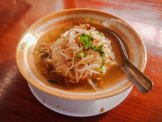 Soto is traditional Indonesian soup mainly composed of broth, meat or chicken, and vegetables.