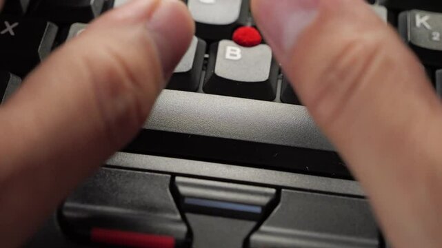 Black Laptop Spacebar Hit. Person types and hits the spacebar on a laptop.