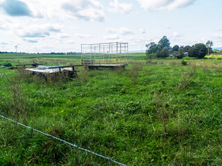 Farm Equipment Abandon In A Large Field Or Over Grown Grass