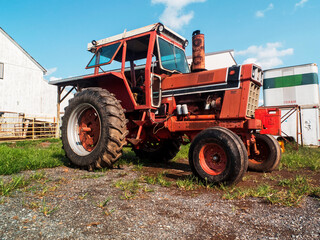 Old Red Tractor On THe Field Of Farm
