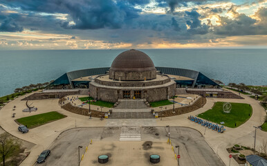 Fototapeta premium Aerial view of Adler Planetarium on Lake Michigan in Chicago with lake front views