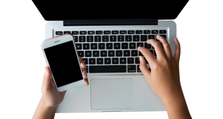 person using a laptop and mobile phone. shot with high angle view