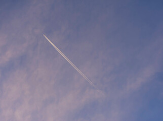 A Jet plane flies high across the Australian sky.. 