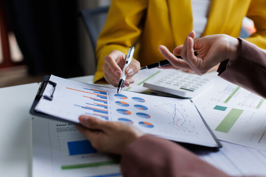 Closed up of two business brainstorm discussion, meeting of business team working financial trading growth, together, project team corporate briefing.