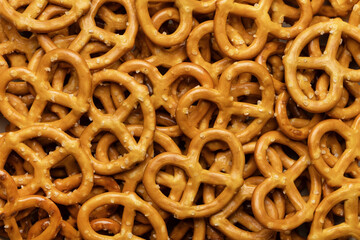 Mini pretzels, baked goods background, studio shot, close-up.