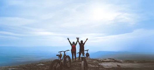 Selbstklebende Fototapeten Entspannung Asian lover women and men Travel Nature. Travel relax ride a bike Wilderness in the wild. Standing on a rocky cliff. travel Thailand  © last19