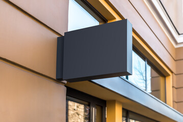Blank Mockup Of Cafe Black Signboard On A Yellow Wall