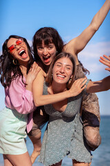 Group of smiling multiethnic women enjoying vacation. Beautiful and cheerful girls of generation z...