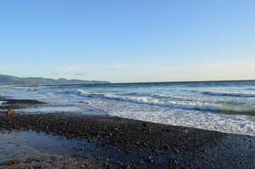 Sunny Day Over Rocks and Water