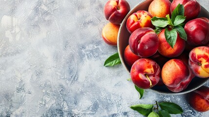 Fresh nectarines arranged in a white dish with a bright backdrop, zoomed in.