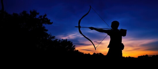 Silhouette of an Archer Against a Sunset Sky