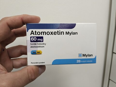 Prague, Czech Republic - July 10 2024: ATOMOXETIN MYLAN box of medication with ATOMOXETINE active substance by MYLAN, used for treatment of ADHD.