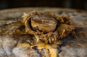 Aging process of cognac spirit in old dark French oak barrels in cellar in distillery house, Cognac white wine region, Charente, Segonzac, Grand Champagne, France