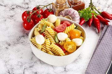 Italian pasta with mozzarella and tomato