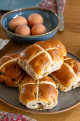 Traditional British Easter food, fresh baked cross buns with raisins or apples