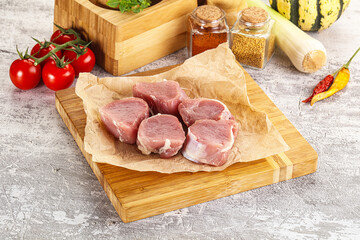 Uncooked raw pork tenderloin medallions