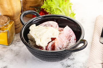 Salad with sliced tomato and stracciatella