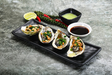Open half oysters with green onion