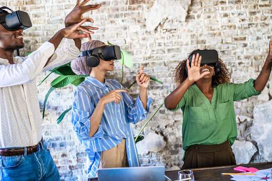 Diverse team exploring virtual reality: Innovation and technology in modern workspace