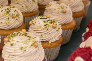 Sweet dessert fresh baked meringue cup cakes in bakery