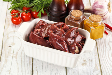 Raw chicken liver uncooked in the bowl