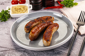 Delicous natural roasted sausages in the plate