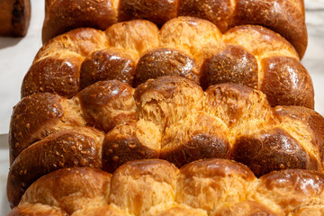Traditional Jewish bread challah braided brioche bread in bakery
