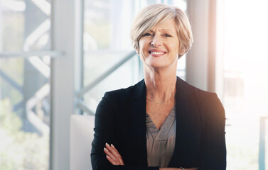 Woman, crossed arms and mature in office portrait, confident and smile with financial manager....