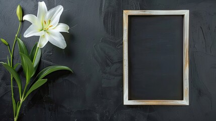 A still life with black candles, white lilies, and an open book arranged in a somber setting.