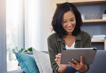 Happy woman, blog or tablet on couch for reading online ebook, research or article on social media. in home. News, interior decoration or girl on touchscreen technology for renovation in modern house
