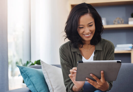 Happy woman, blog or tablet on couch for reading online ebook, research or article on social media. in home. News, interior decoration or girl on touchscreen technology for renovation in modern house