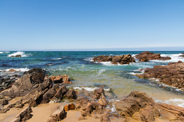 rocks and crashing waves on the beach