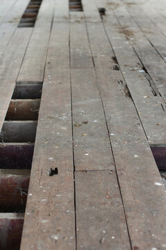 Declination of old wooden balcony or platform.Interior of a dirty and dilapidated room in an abandoned house.