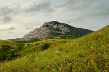 Mountain Zmeyka near Mineralnye Vody town, North Caucasus, Russia. Panoramic view of Zmeyka mountain, part of which was disfigured during mining explosions.