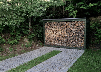 box for wood fireplace. store wood and driveway directly with two strips of paving stones