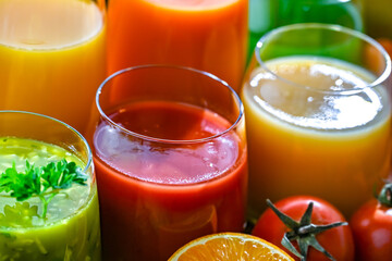 Glasses with fresh organic vegetable and fruit juices