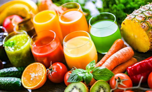 Glasses with fresh organic vegetable and fruit juices