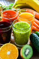 Glasses with fresh organic vegetable and fruit juices
