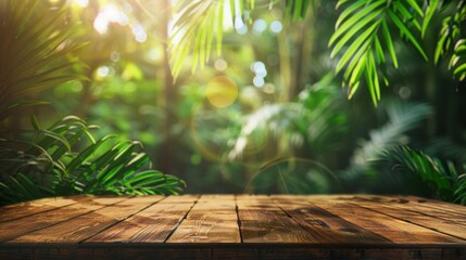 Empty wood table top with blur vibrant jungle leaves background and soft glowing bokeh light