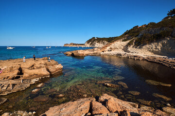 Fototapeta premium rocky bay calm blue sea
