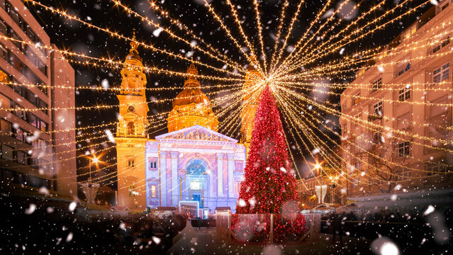 Christmas market at Saint Stephen Basilica in Budapest, with festive lights and holiday charm,  Hungary