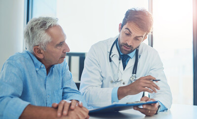 Hospital, doctor and men with clipboard in discussion for health insurance, feedback or planning....