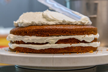 view of making cake with bread and cream