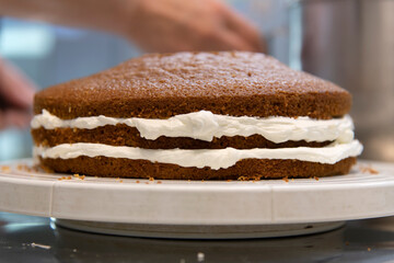 view of making cake with bread and cream